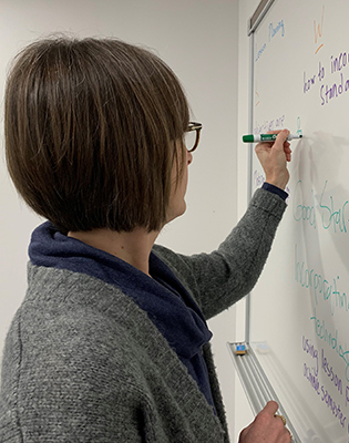 Instructor writing on a board